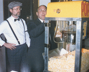 Manager Bruce Morgan sets up an additional popcorn station at the back of the house